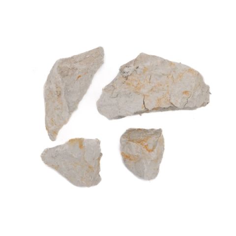 Four rough chunks of pale grey-white clay, dry and crumbly, their broken faces streaked with rust-orange staining.