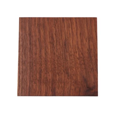 A square of black walnut, planed smooth, its grain running in straight dark chocolate stripes against a warmer red-brown ground.