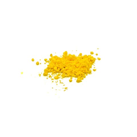 A small heap of vivid yellow pigment powder, coarsely clumped with loose grains scattered around it.