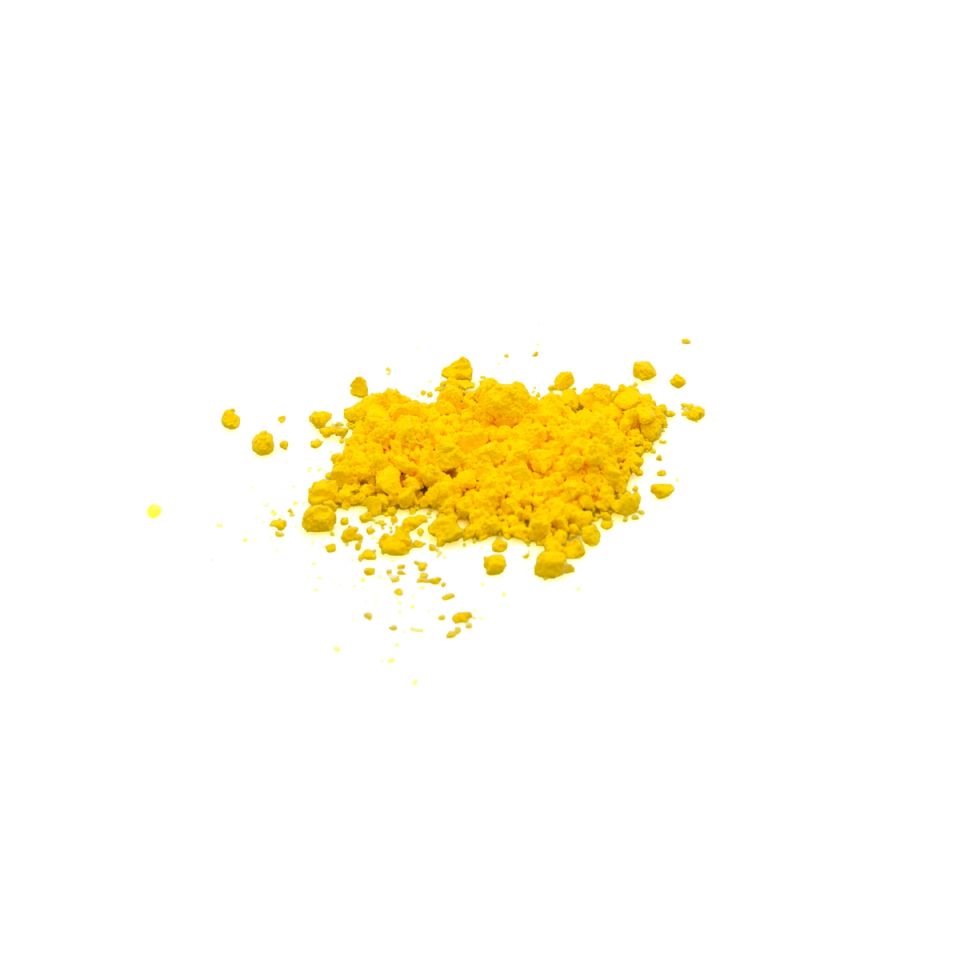 A small heap of vivid yellow pigment powder, coarsely clumped with loose grains scattered around it.