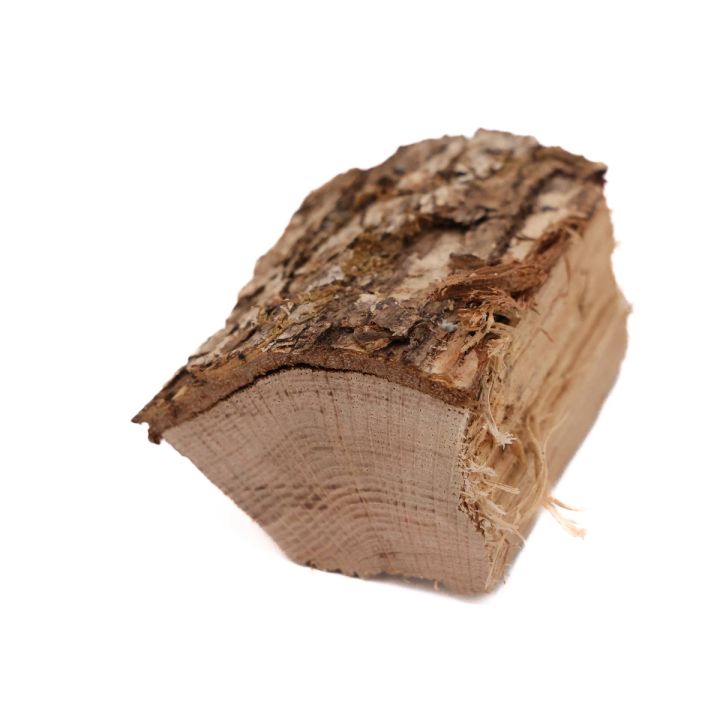 A split block of white oak with bark still attached along one edge, the sawn end showing pale growth rings and torn fibres.