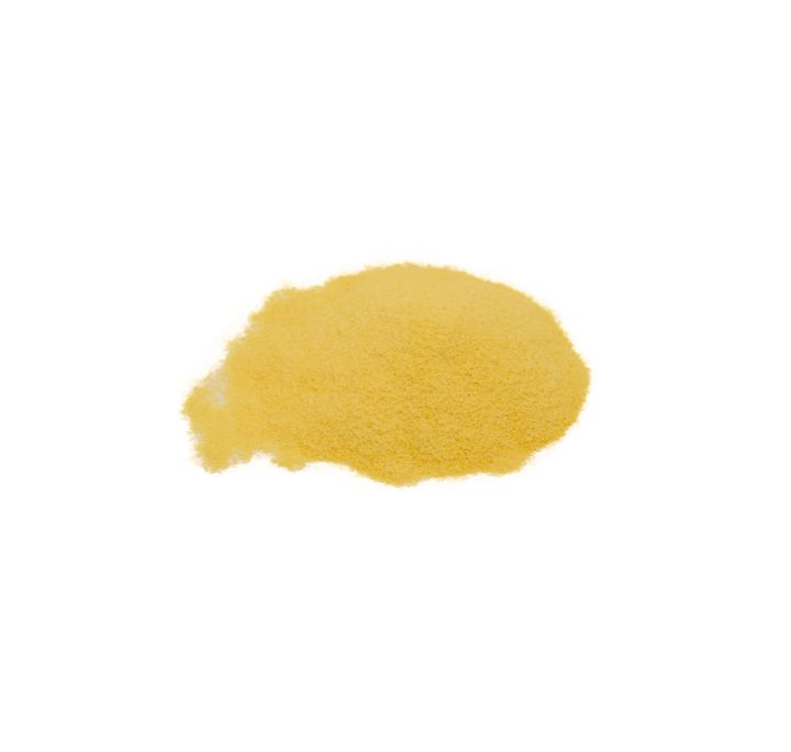 A mound of enamel powder in soft golden yellow, finely milled and evenly sifted.