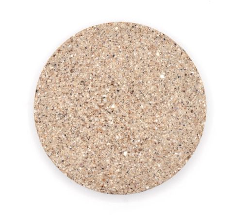 A larger round tile of dense composite in pale oatmeal, evenly speckled with fine crushed shell.