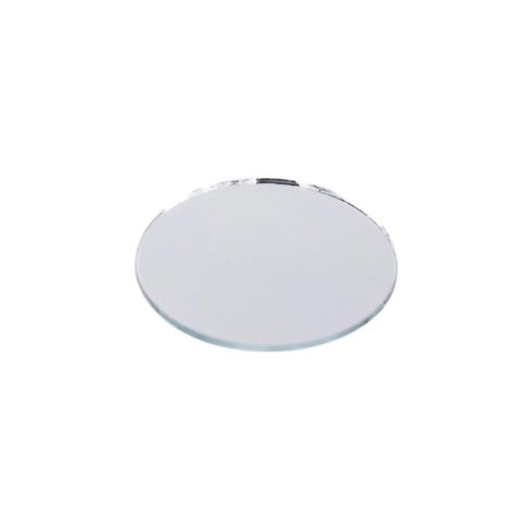 A small round mirror seen at a low angle, its silvered face reflecting flatly with a bright sliver of light along the top edge.