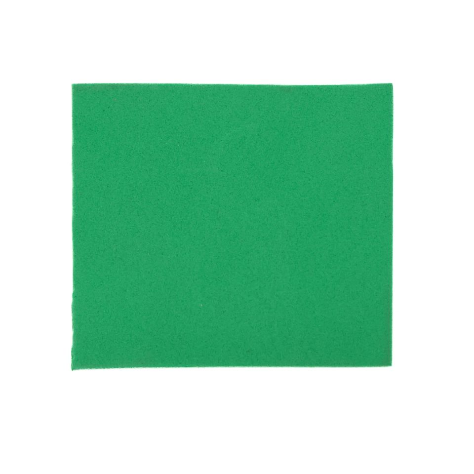 A square sheet of dense foam in bright grass green, its surface flat and evenly matte.