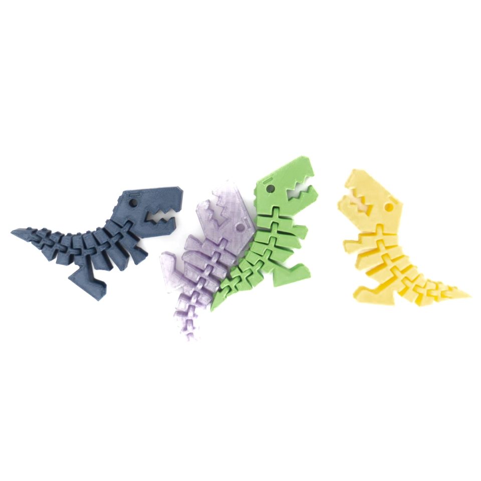 Four small 3D-printed dinosaur figures with segmented, articulated bodies, in navy, lilac, green and yellow.