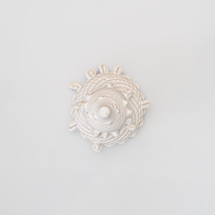 The same vessel seen from directly above, its printed coils spiralling in concentric rings from a central point with the nubs radiating around the rim.