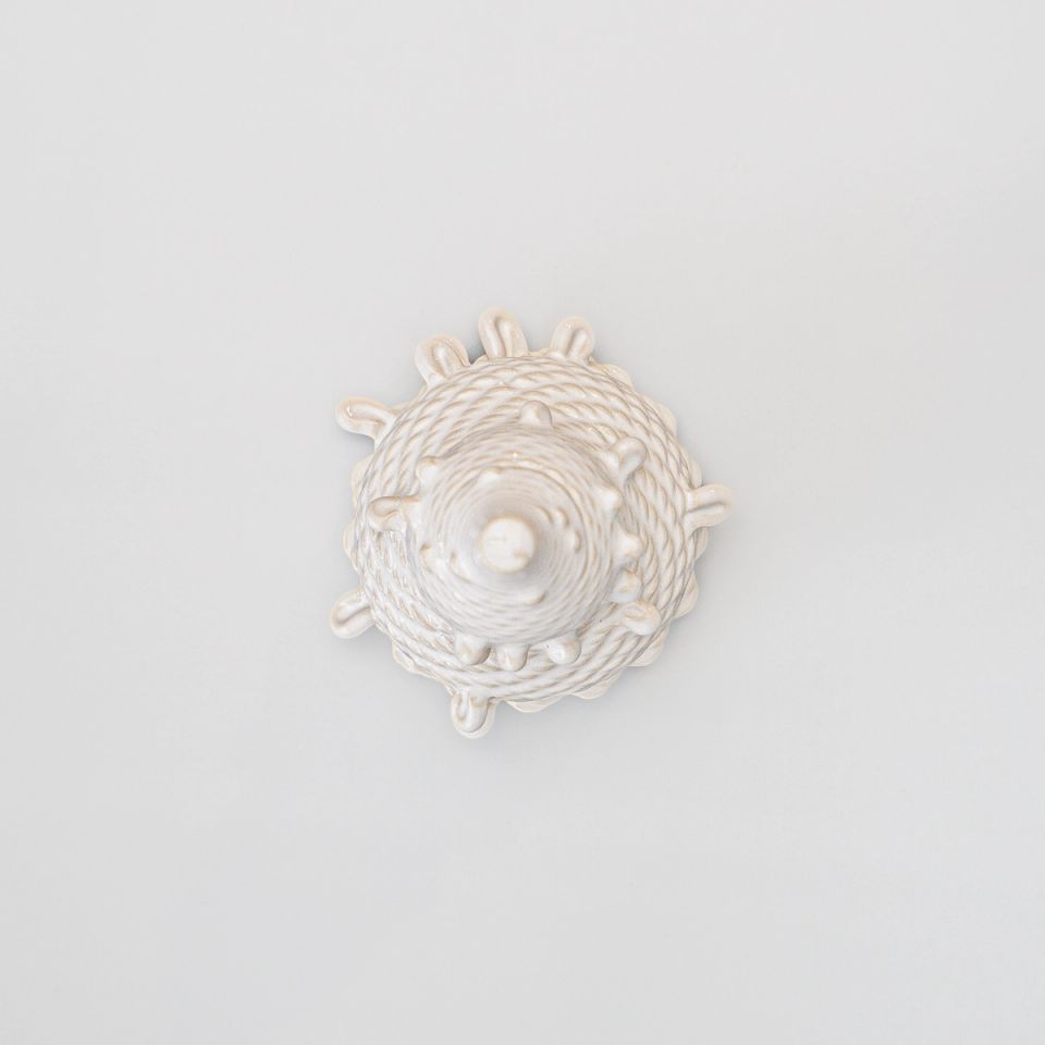 The same vessel seen from directly above, its printed coils spiralling in concentric rings from a central point with the nubs radiating around the rim.