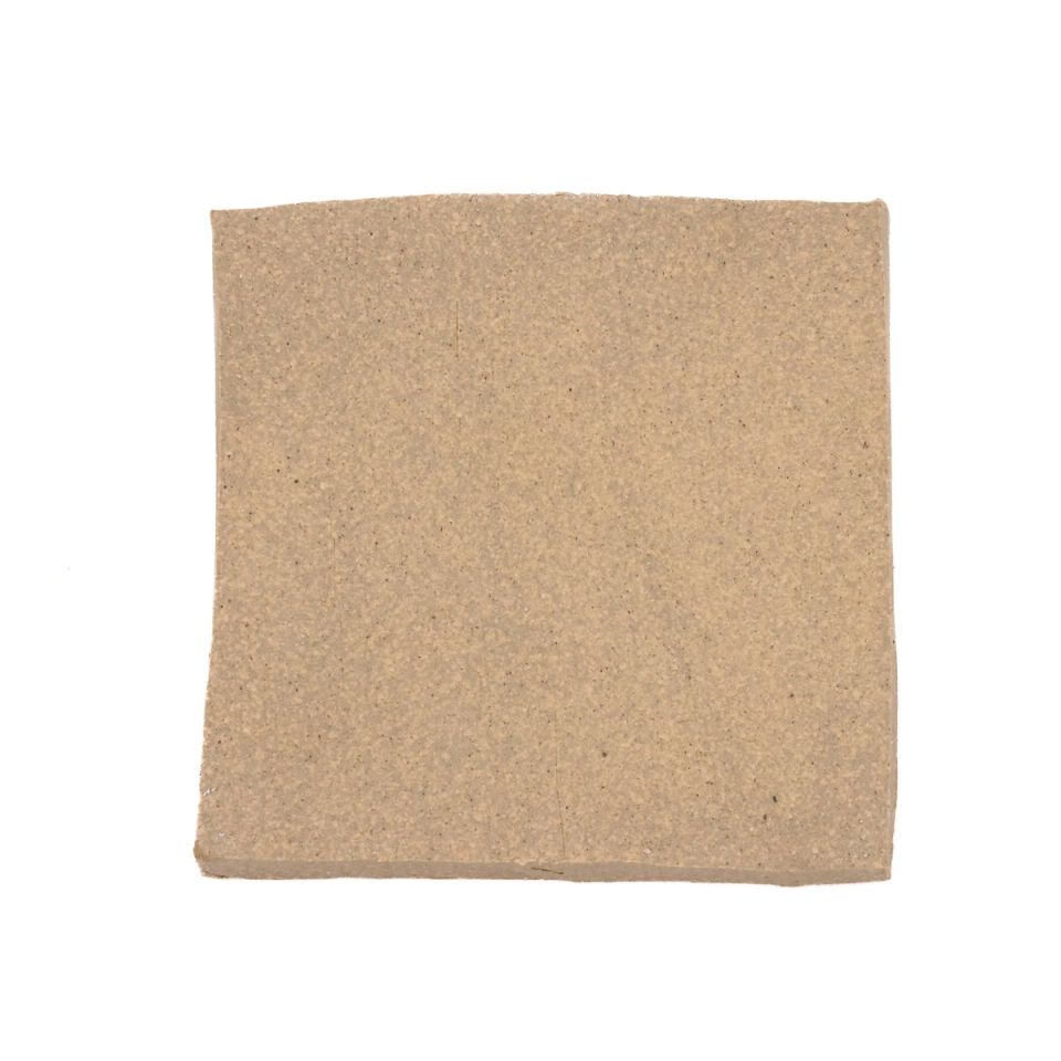 A square fired slab in warm sandy buff, its surface evenly grainy with slightly wavering edges.