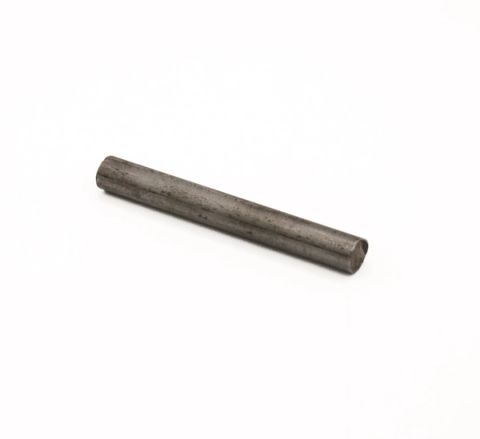 A short steel rod lying at an angle, its surface dull grey with faint darker mottling and a brighter cut end.