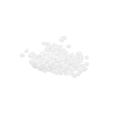 A scatter of small white plastic pellets, each an opaque rounded bead with a soft sheen.