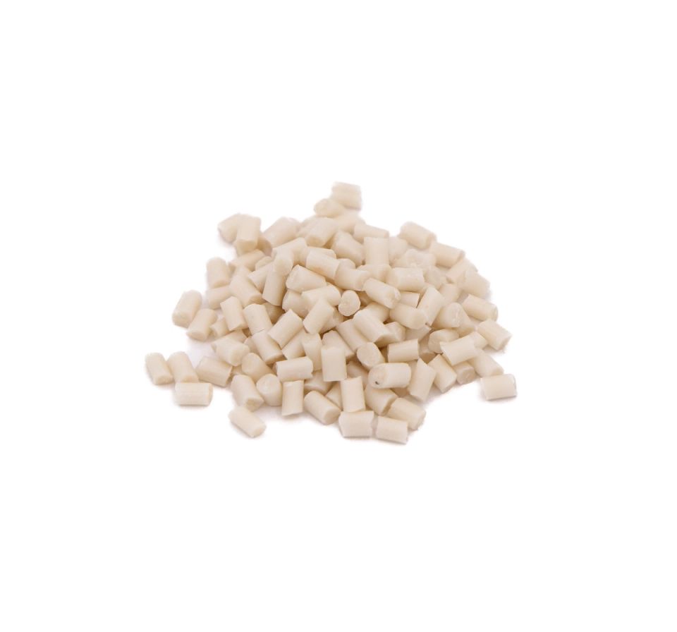 A small heap of short cylindrical plastic pellets in creamy off-white, each cut flat at both ends.