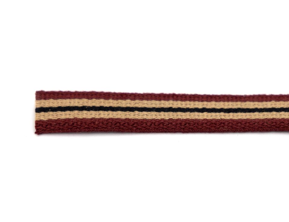 A length of woven tape in tan with deep burgundy edges and a narrow black stripe running down the centre.