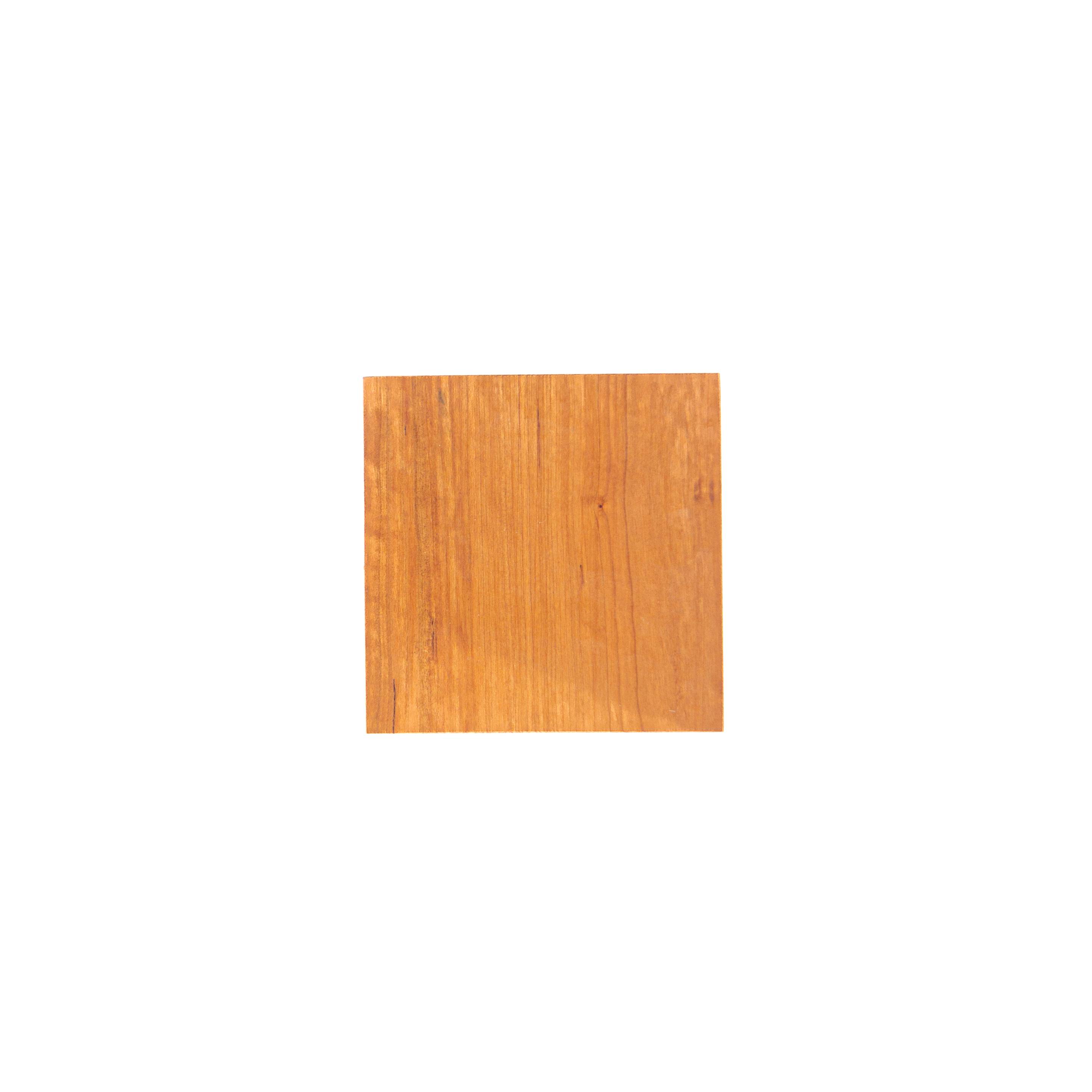 A small square of cherry in warm orange-brown, its grain running in fine straight vertical lines.