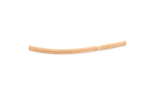 A single slender rattan reed curving gently, pale honey-coloured and split at one end.