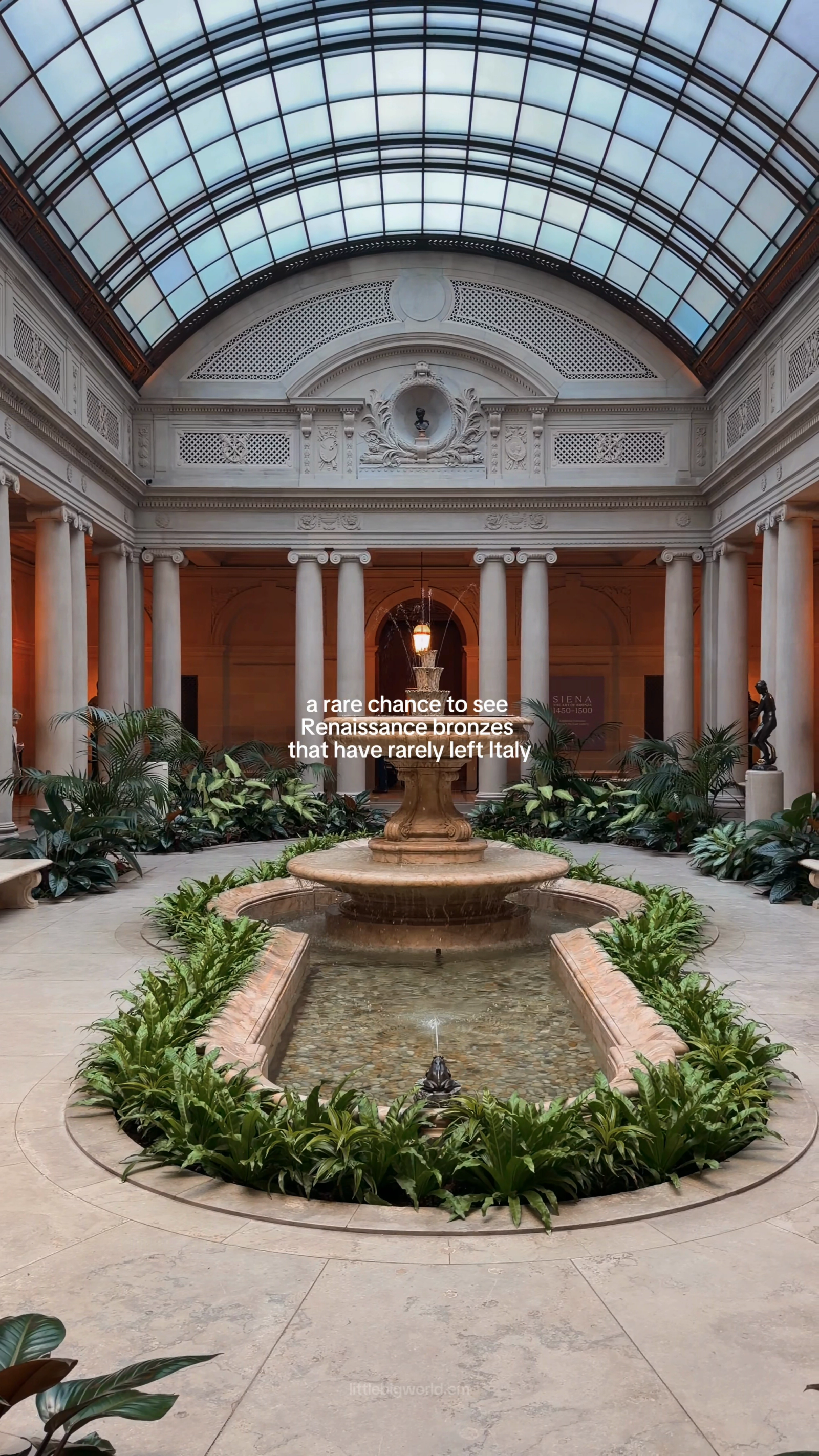 The Frick garden court, with a fountain beneath a glazed ceiling.