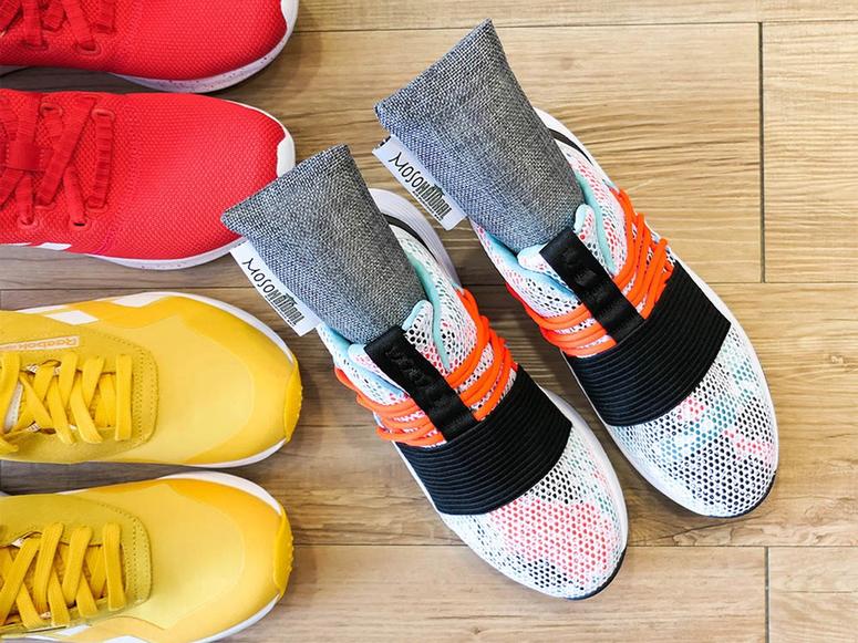 Moso natural pouches inside a pair of sneakers.