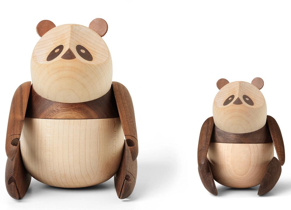 Two wooden pandas—one small, one large.