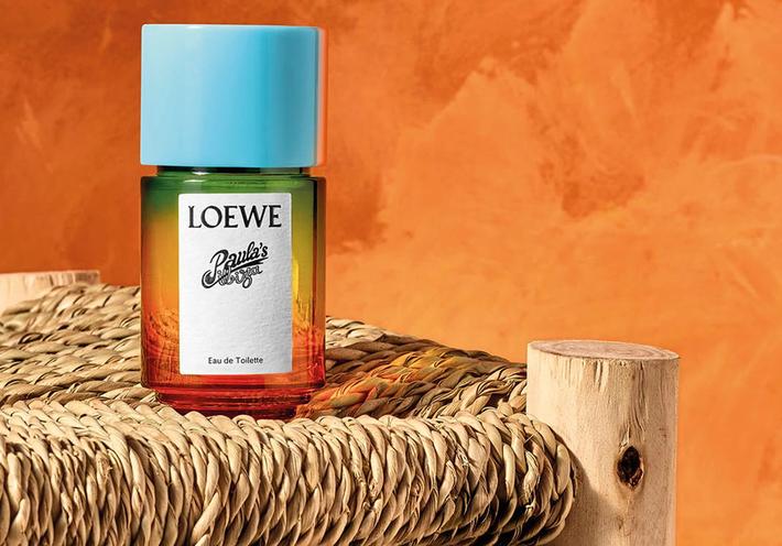 A bottle of Loewe perfume on a straw chair