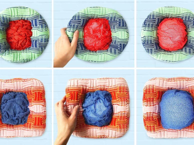 Plush, knitted lights in multiple colors with a hand squeezing them.