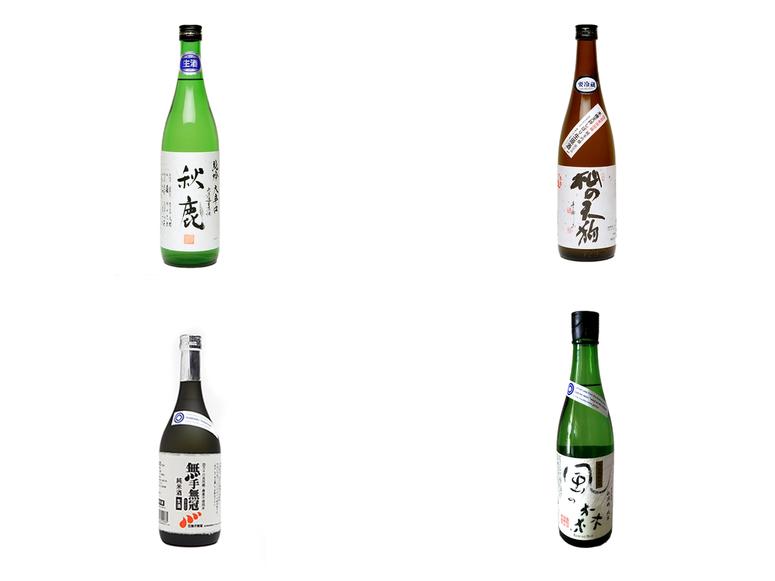 Four sake bottles on a white background.