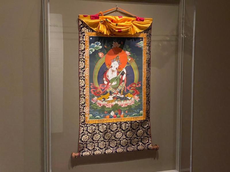 A scroll, dating from 2014, of the Hindu goddess Saraswati painted on cotton with a silk brocade by the Tibetan artist Buchung Nubgya. (Photo: Spencer Bailey)