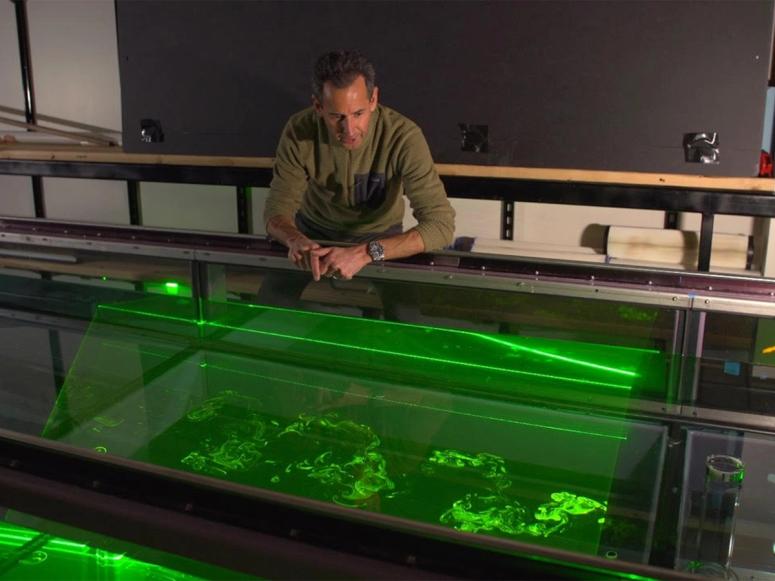 Professor John Crimaldi using lasers to render odor plumes visible. (Courtesy John Crimaldi)