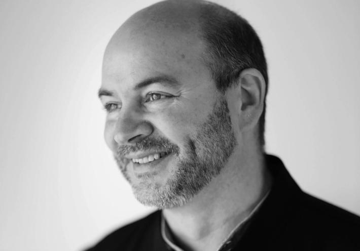 Black and white photo of Snøhetta co-founder Craig Dykers 