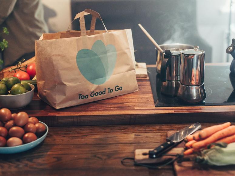 Paper bag on a table with food
