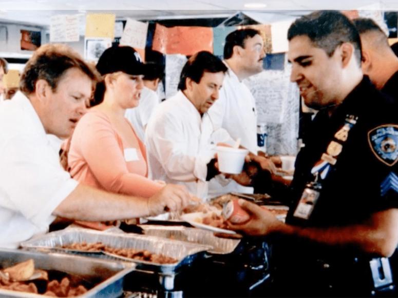 Daniel Boulud and other chefs serve food to first responders after the attacks in September 2001