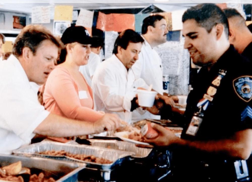 Daniel Boulud and other chefs serve food to first responders after the attacks in September 2001