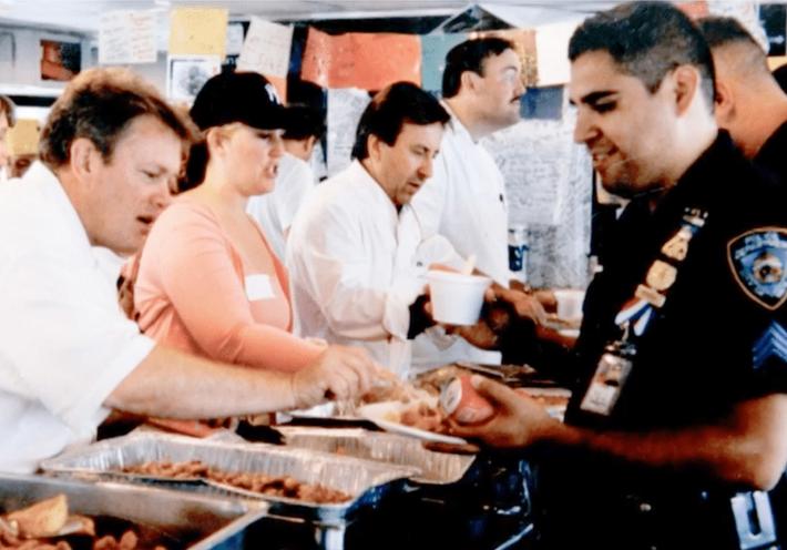 Daniel Boulud and other chefs serve food to first responders after the attacks in September 2001