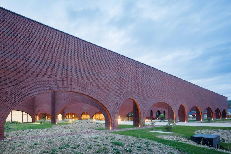  “Precises Acts” (2023) the leather goods workshop Ghotmeh designed for Ateliers Hermès in Normandy, France. (© Lina Ghotmeh Architecture and Hermès. Photo: Iwan Baan)