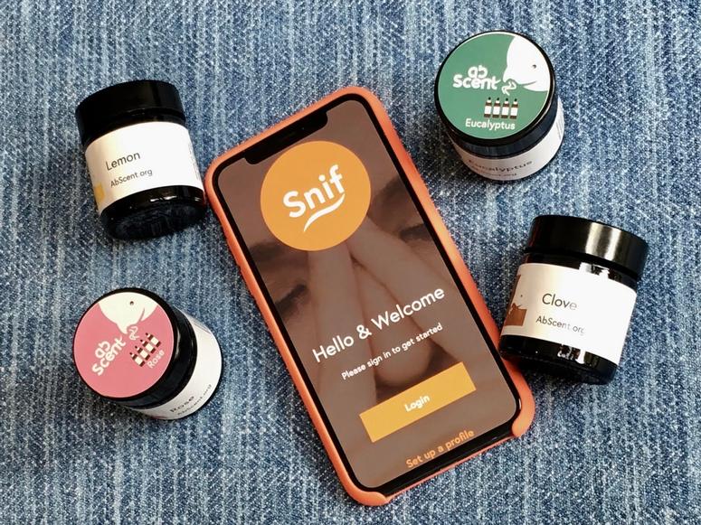 Four abscent bottles surround an iPhone running the Snif app.