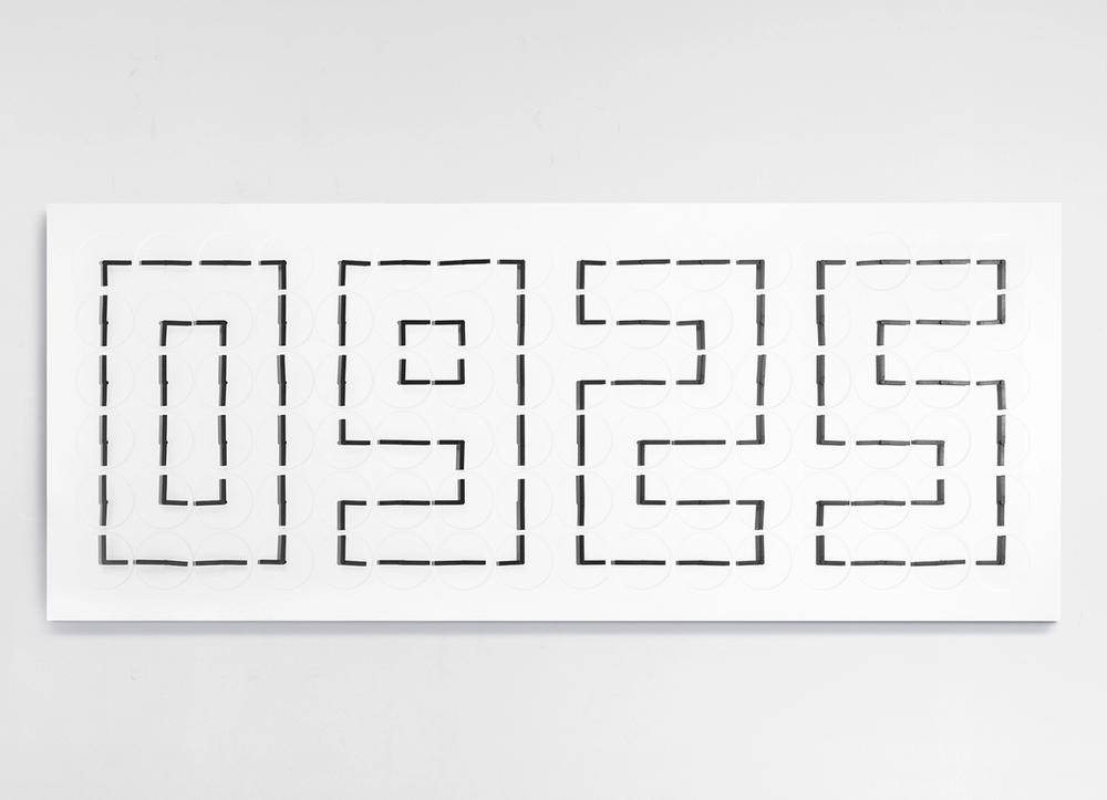 A white wall piece reading "0925" in dotted lines.