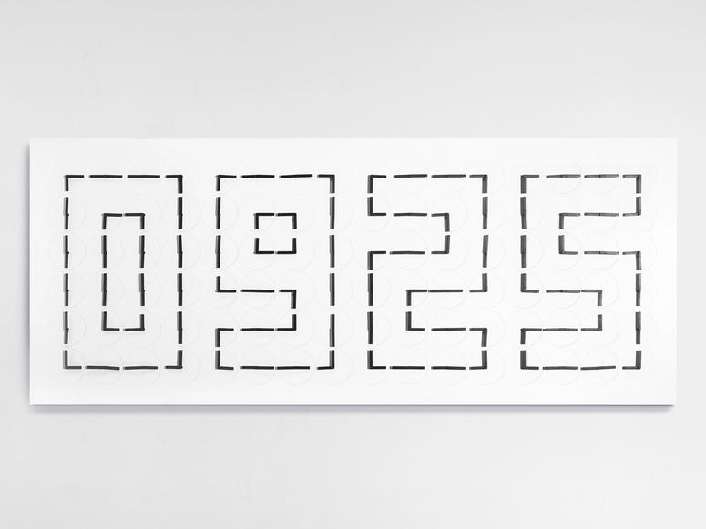 A white wall piece reading "0925" in dotted lines.