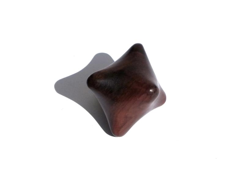 A wooden polygonal massage tool.