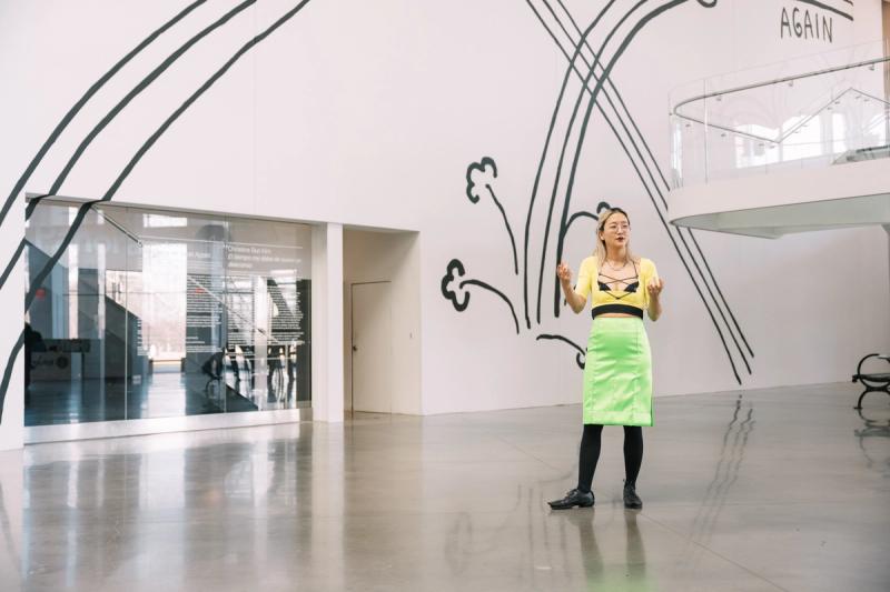 Christine Sun Kim at the March 2022 opening for “Time Owes Me Rest Again.” (Photo: Kuo-Heng Huang. Courtesy the Queens Museum.)