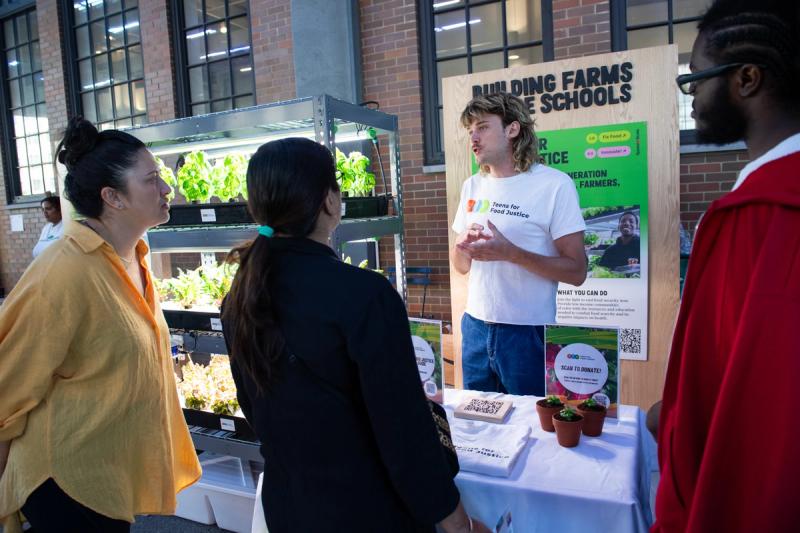 A representative from Teens for Food Justice presenting at the fair. (Courtesy Emerson Collective)