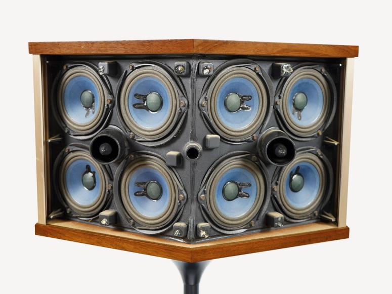 An eight-cone speaker system on a white background.