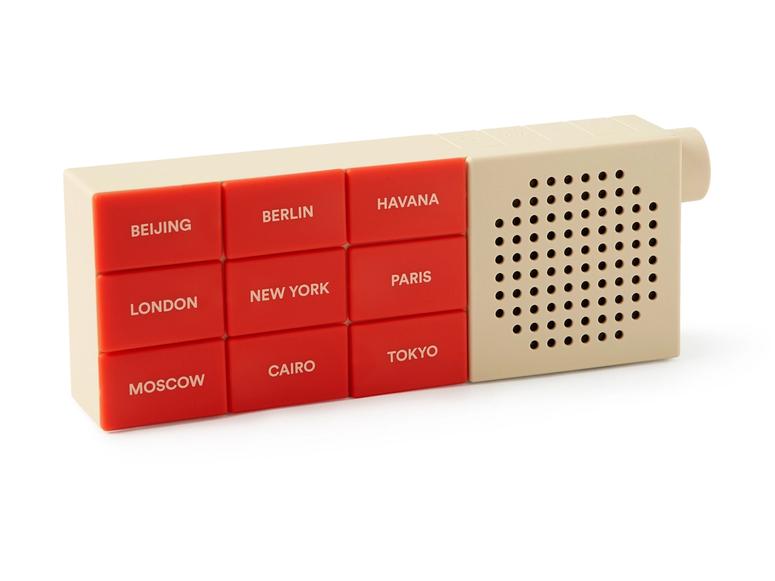 A red and white Radio Flyer with city names on its buttons.