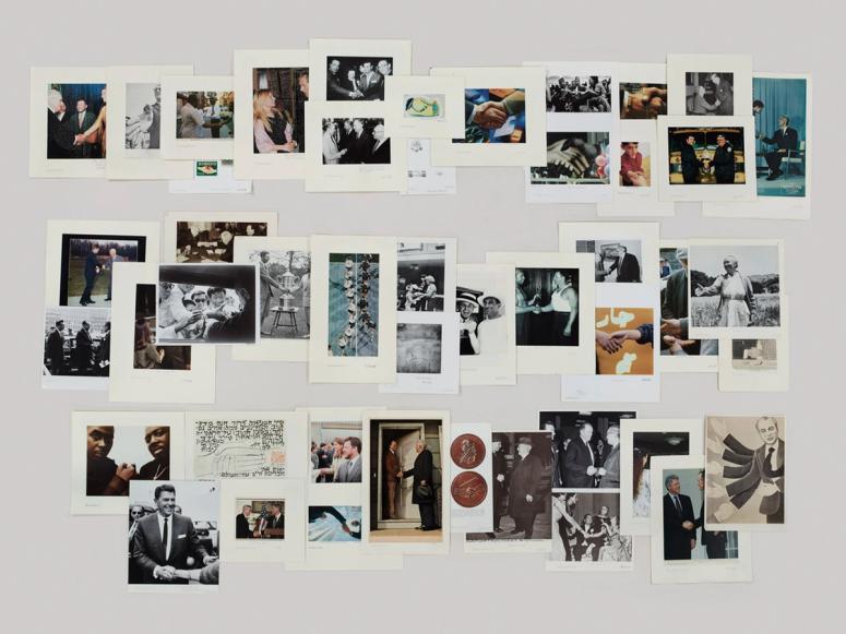 A photograph of images from the Picture Collection’s Handshaking folder by Taryn Simon, featured in the exhibition “The Color of a Flea’s Eye.”