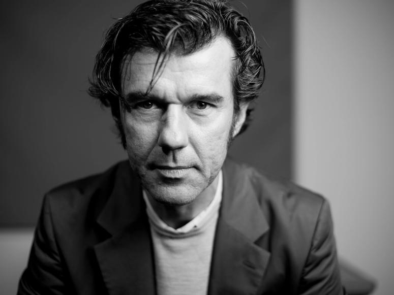 Stefan Sagmeister looking straight into the camera.