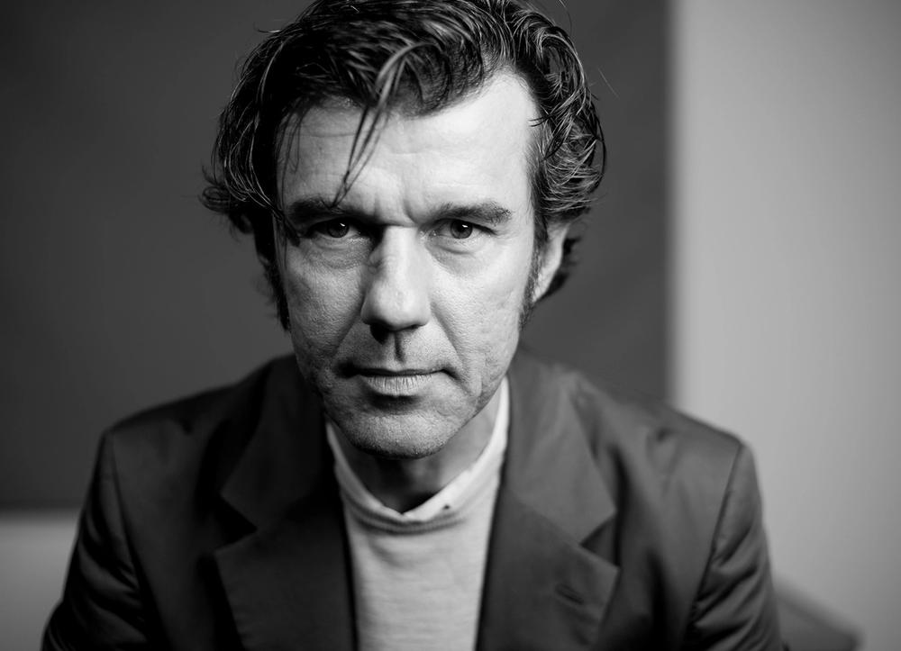 Stefan Sagmeister looking straight into the camera.