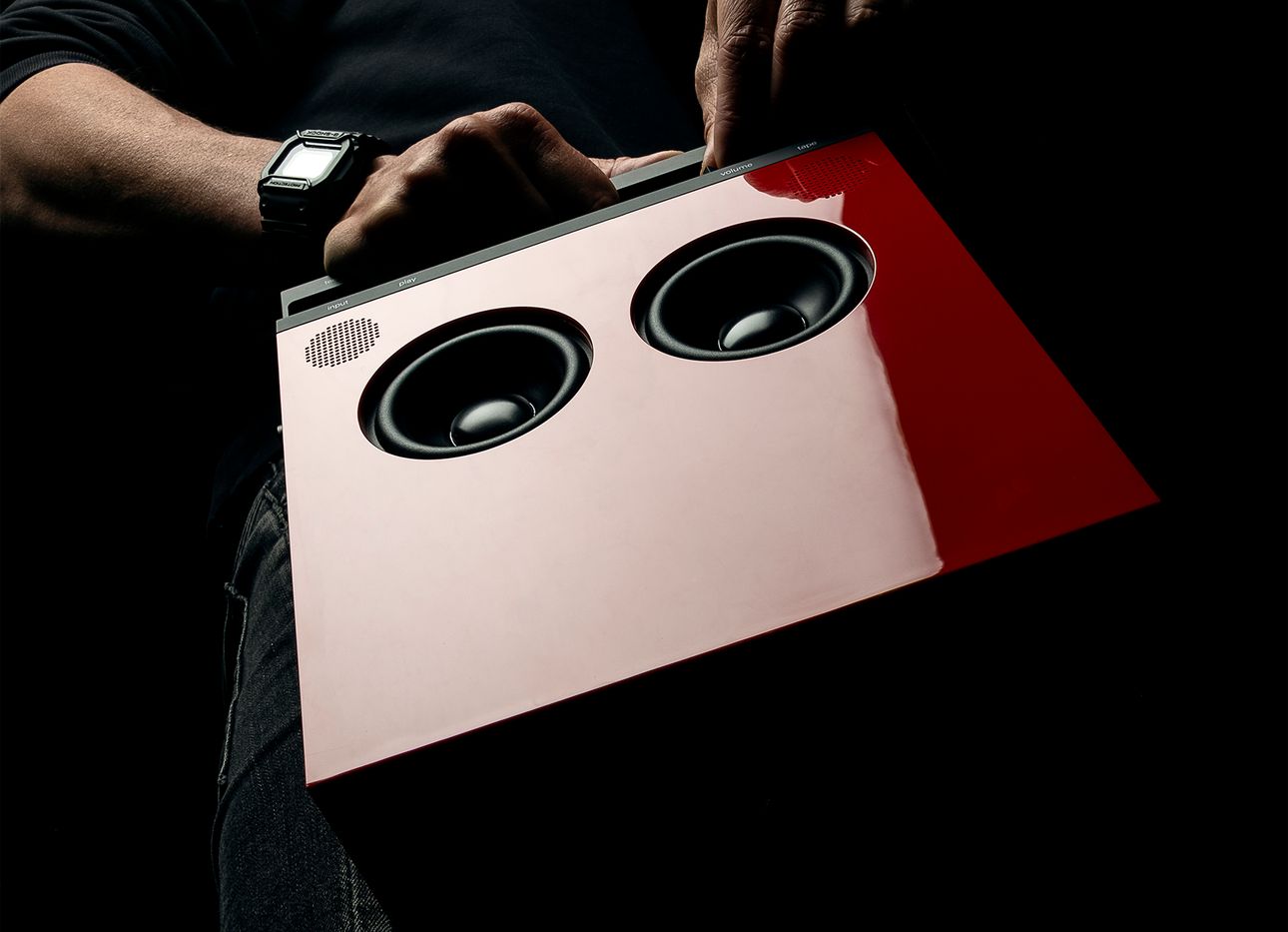 A red OB-4 boombox photographed from below.