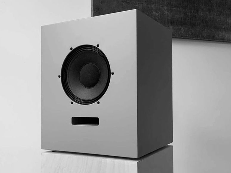 An Ojas bookshelf speaker in black and white.