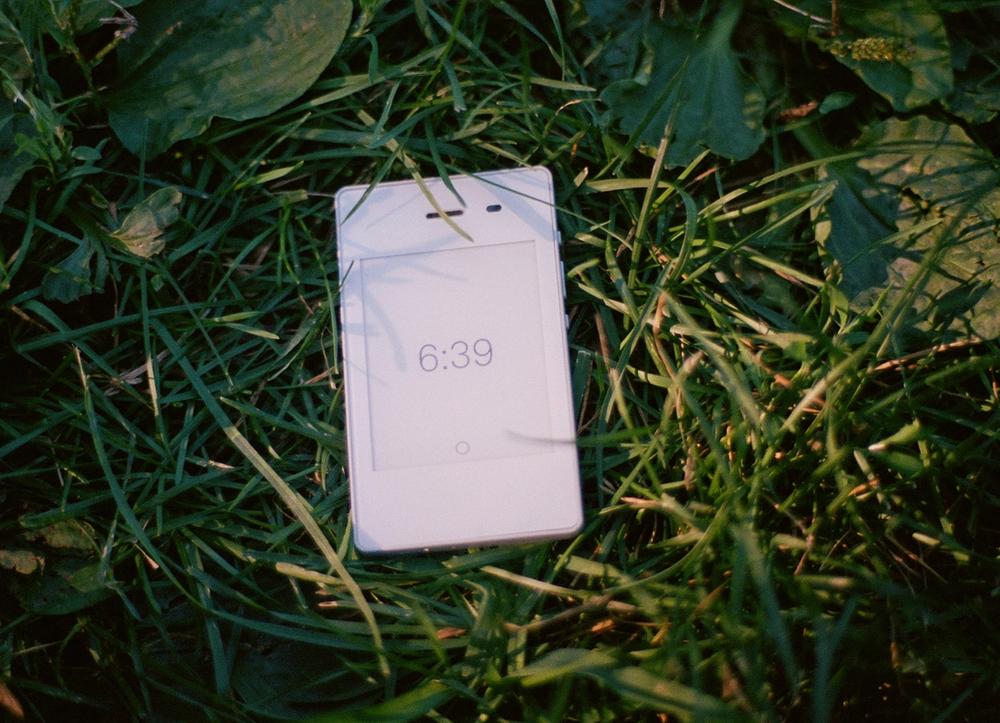 A white Light Phone in grass.