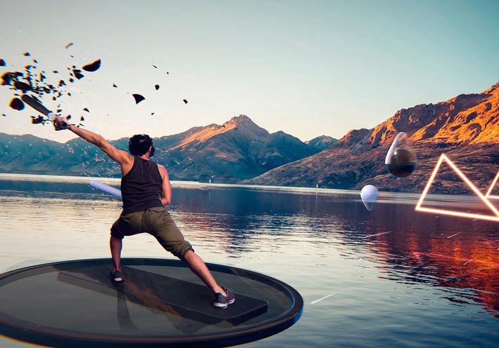 A man in virtual reality playing an exercise game, floating on a disk above a lake.