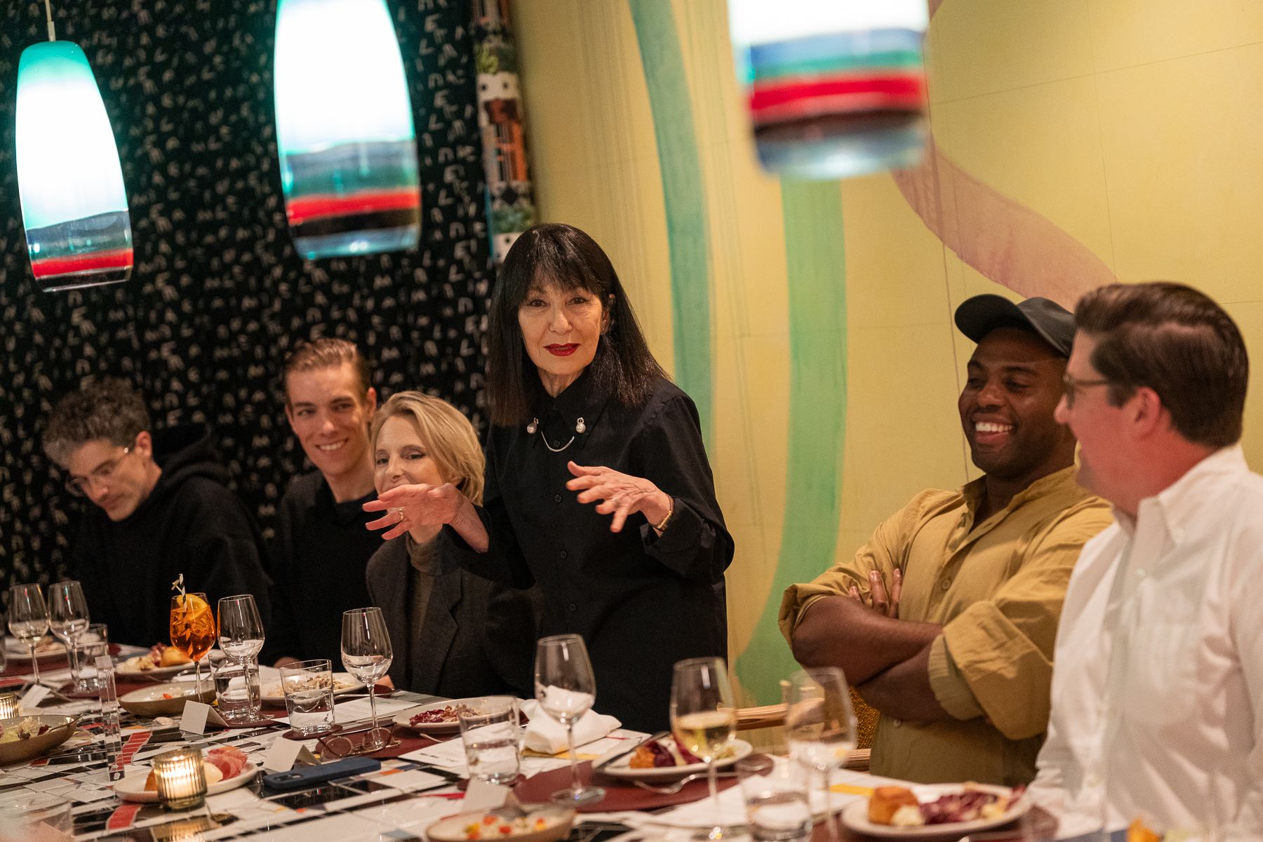 November 10, 2025, New York City | RoseLee Goldberg, the founding director and chief curator of the nonprofit Performa, gives a toast during an intimate dinner co-hosted by The Slowdown and Performa at the restaurant Manuela, with guests including Camille Henrot, Adam Pendleton, Kim Hastreiter, Stephanie Goto, and Eddie Stern. (Photo: Angela Pham/Deitch + Pham) 