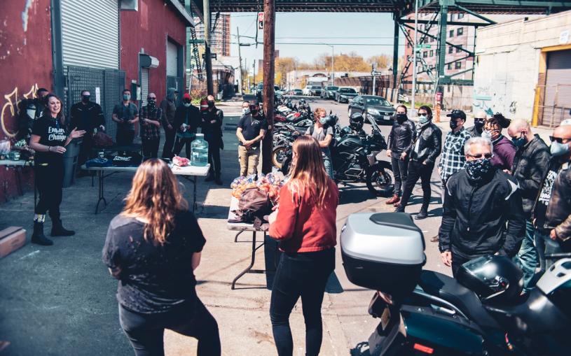 Kirsten Midura speaking to members of Engines for Change at the 2021 Ride for Hunger. (Photo: Peter Domora)